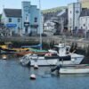Fishing boats docked at a scenic harbour in Northern Ireland