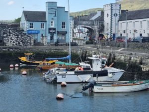 Fishing boats docked at a scenic harbour in Northern Ireland