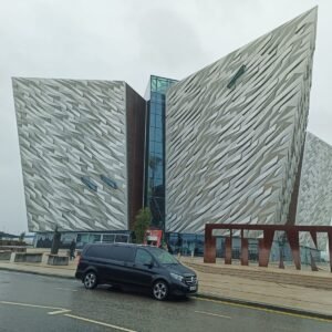 Luxury chauffeur van parked outside Titanic Belfast museum